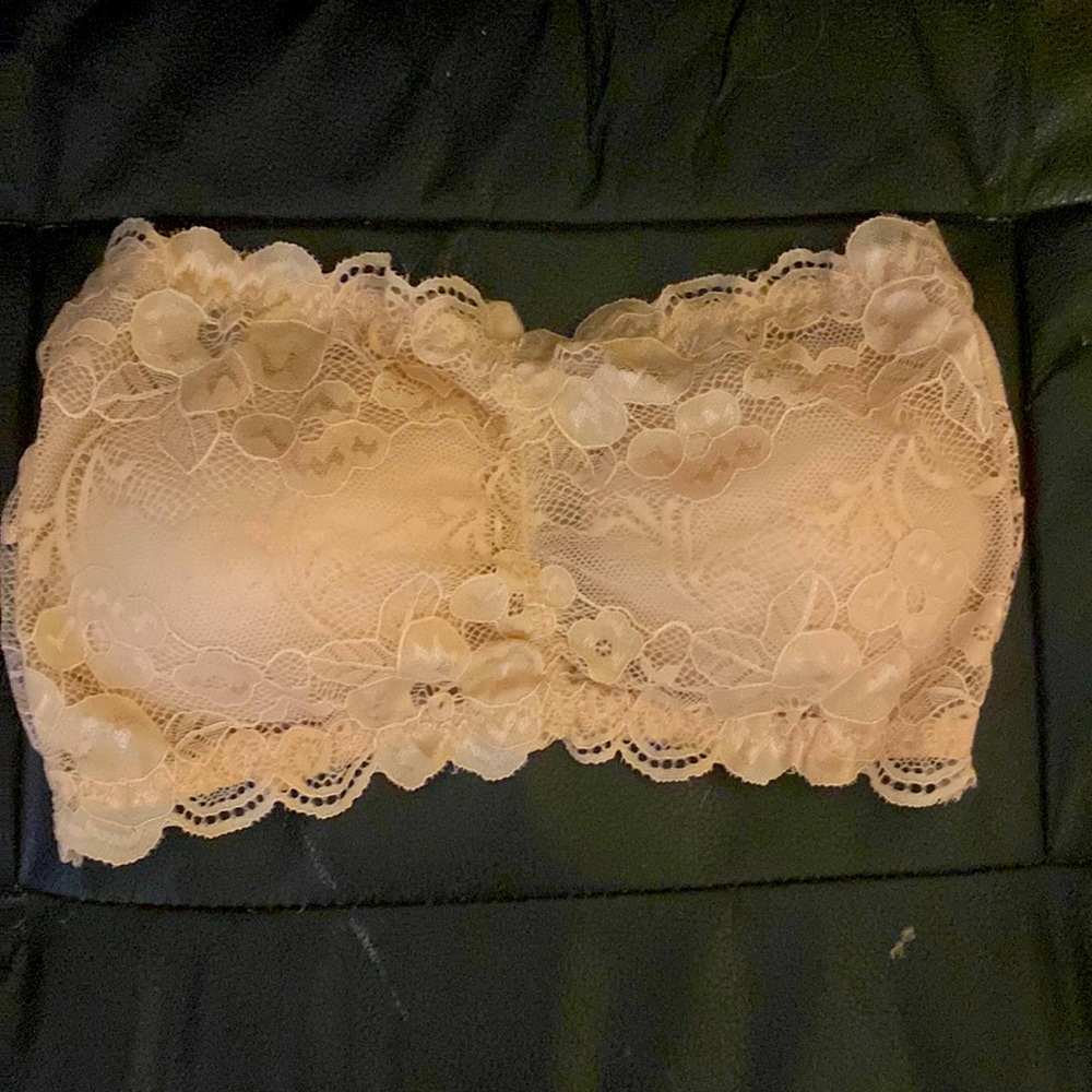 Strapless, Lacy,, and beige colored bralette